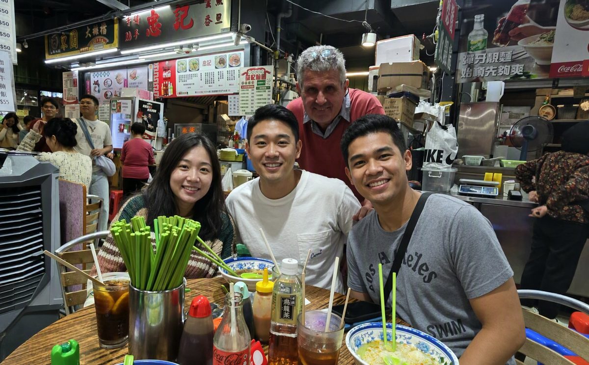 Hans with guests at a cooked-food centre